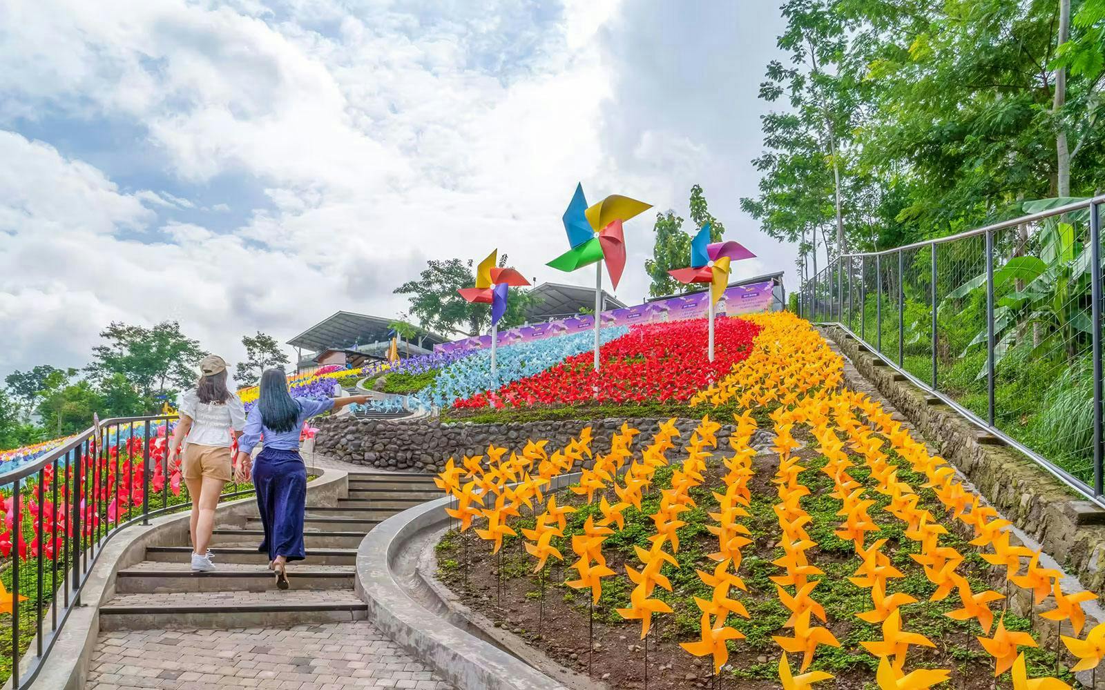 Colorful pinwheels and flower garden at De Windmills, Dairyland Farm Theme Park Prigen.