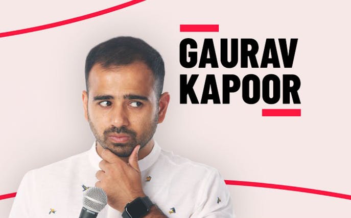 Comedian with microphone at Colors Laughter Night event.