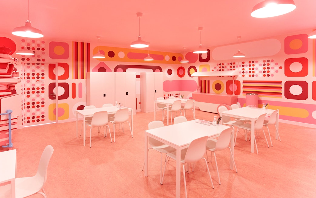 Colorful room with geometric patterns and tables at Museum of Ice Cream Singapore.