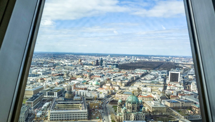 View of Berlin cityscape from the TV tower, featuring Berlin Cathedral and surrounding architecture.