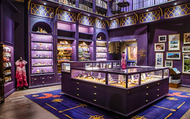 Harry Potter studio shop in London with purple displays and merchandise.