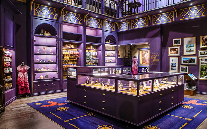 Harry Potter studio shop in London with purple displays and merchandise.
