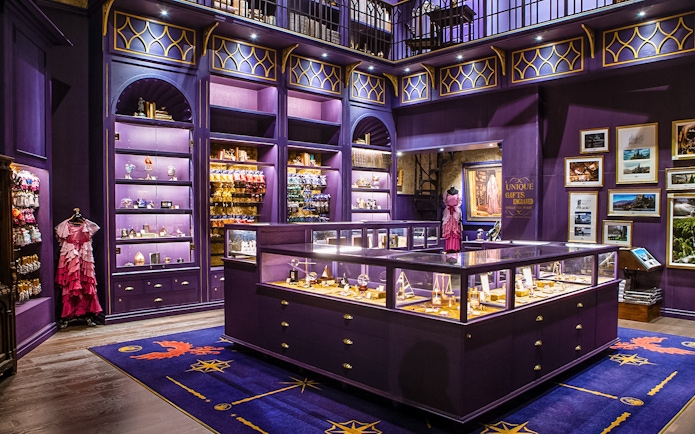 Harry Potter studio shop in London with purple displays and merchandise.