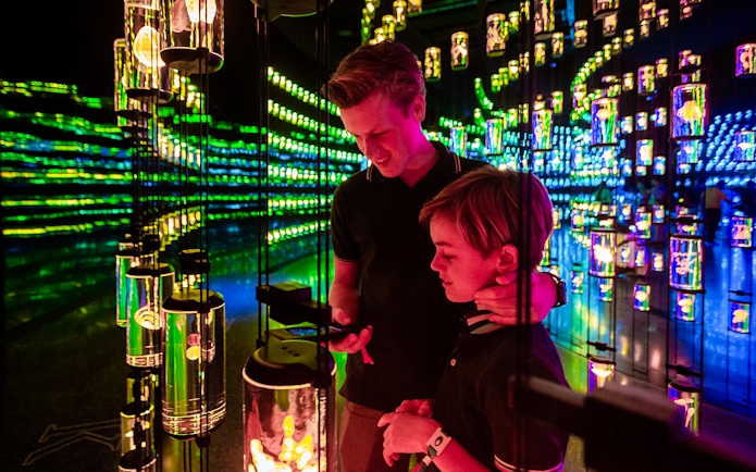 Visitors exploring interactive light display at Museum of The Future, Dubai.