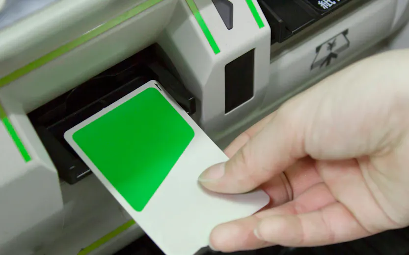 Inserting Suica IC Card into ticket machine in Japan.