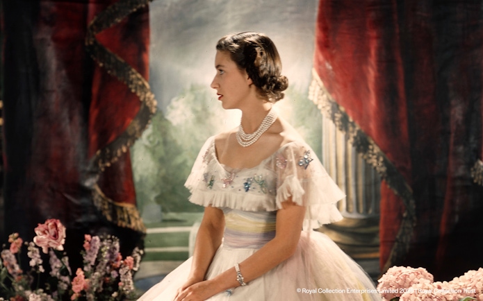 Royal figure in elegant attire at the King's Gallery, Palace of Holyroodhouse.