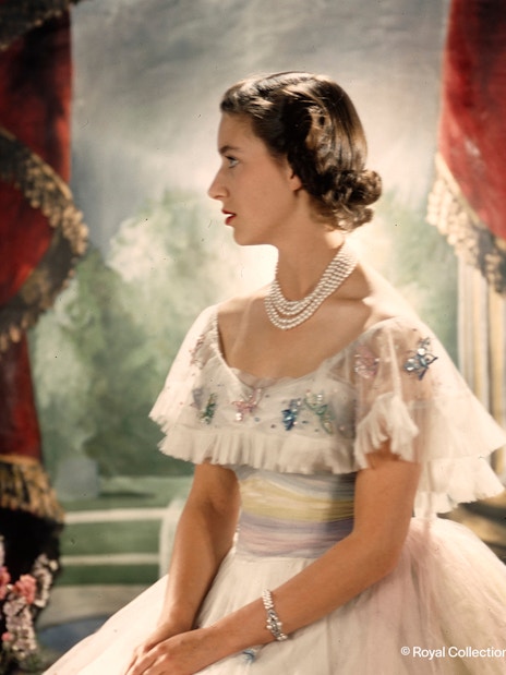 Royal figure in elegant attire at the King's Gallery, Palace of Holyroodhouse.