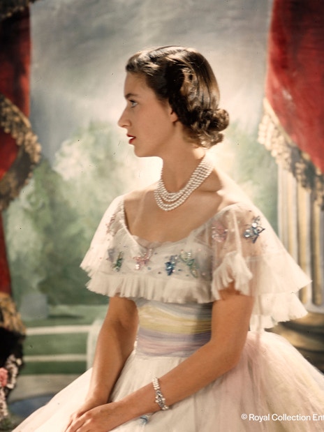 Royal figure in elegant attire at the King's Gallery, Palace of Holyroodhouse.