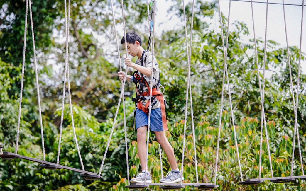 Participant navigating rope course at Mega Adventure Park Singapore.