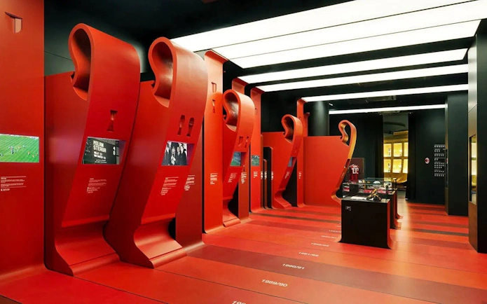 Interactive exhibits at Casa Milan Museum, Italy, showcasing football history.