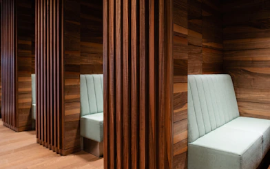 Seating area with wooden panels at BER Lounge Tegel, Berlin Brandenburg Airport Terminal 1.