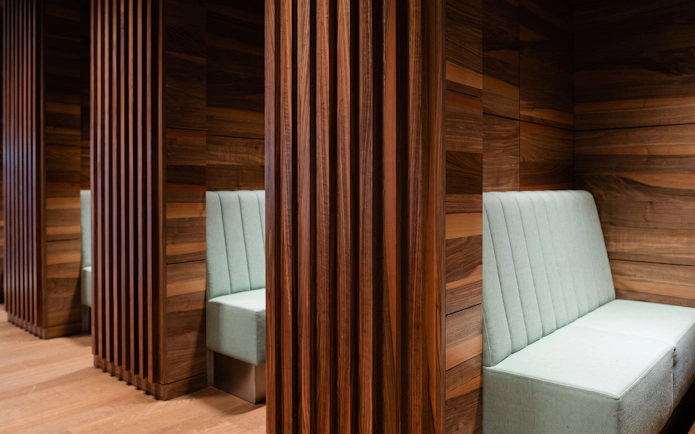 Seating area with wooden panels at BER Lounge Tegel, Berlin Brandenburg Airport Terminal 1.