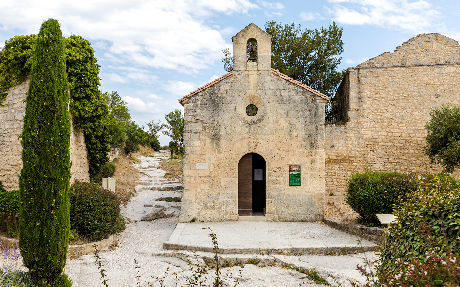 St Vincent Church entrance with stone path, Les Baux De Provence, France.