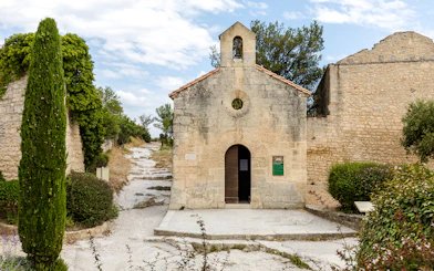 St Vincent Church entrance with stone path, Les Baux De Provence, France.