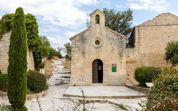 St Vincent Church entrance with stone path, Les Baux De Provence, France.