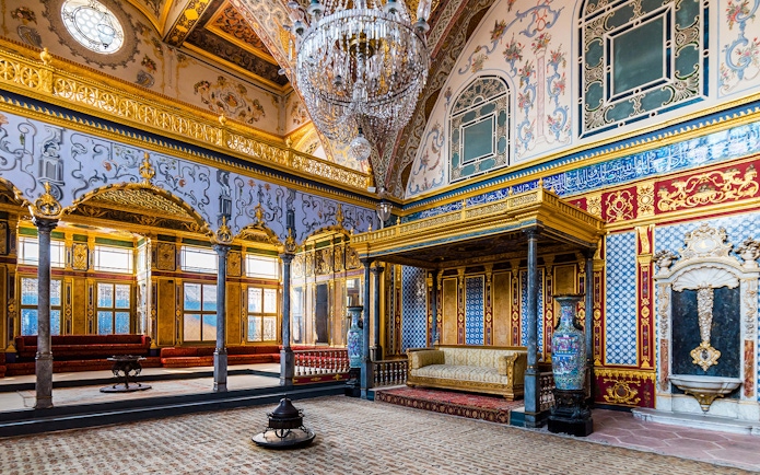 Topkapi Palace Imperial Hall with ornate gold and blue decor, Istanbul.