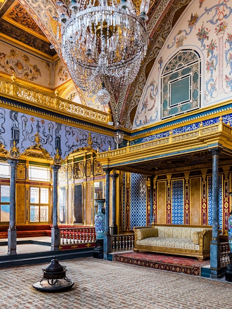 Topkapi Palace Imperial Hall with ornate gold and blue decor, Istanbul.