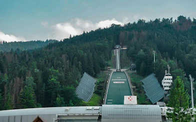 Zakopane ski jump surrounded by forested hills, Poland.