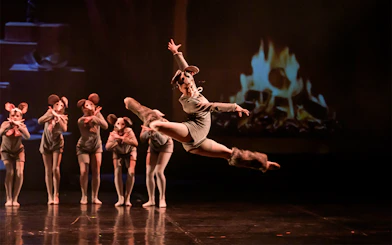 Dancers in mouse costumes performing at Ballet Gala in Prague's Old Town.
