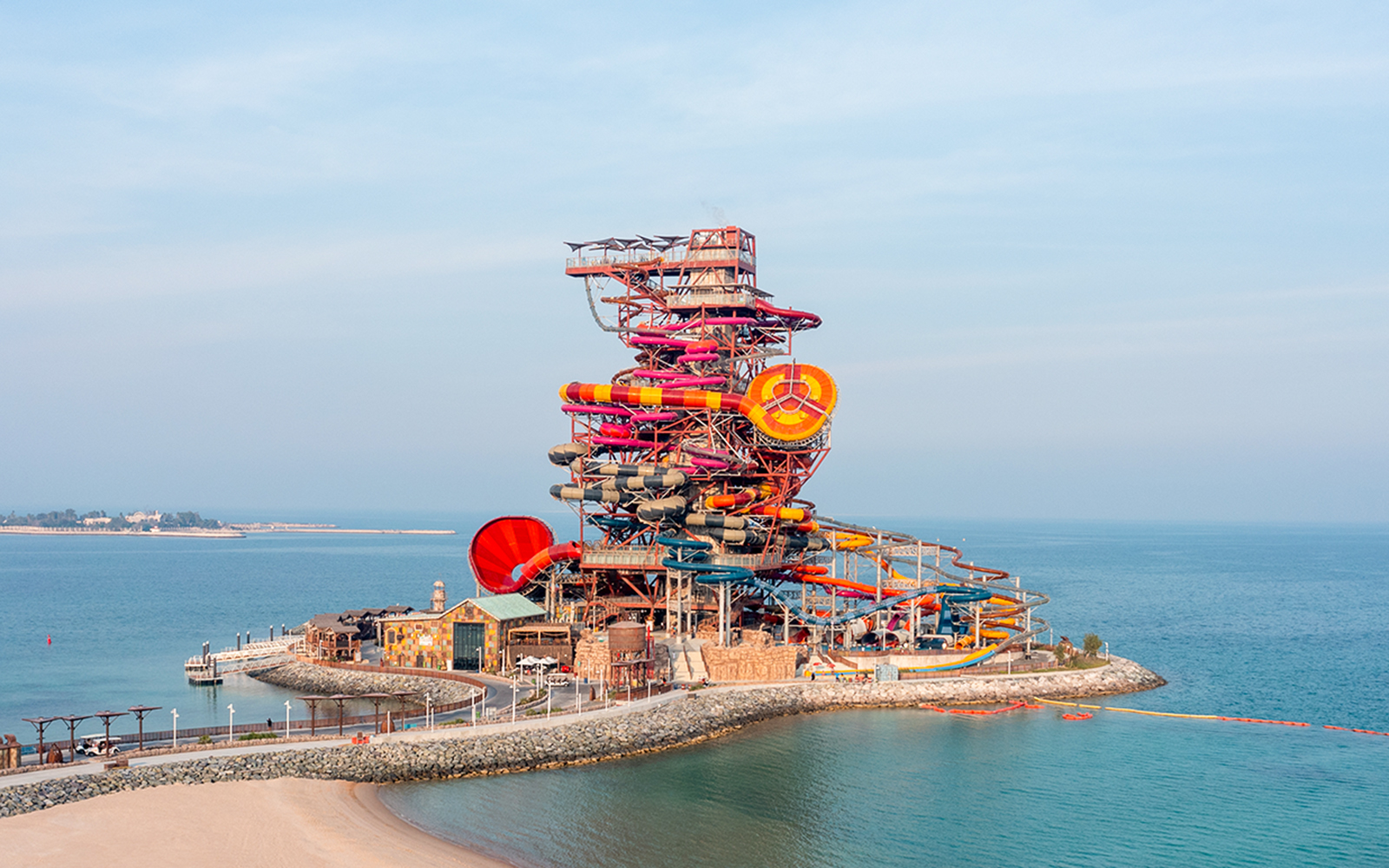 Meryal Waterpark Rig 1938 with colorful water slides by the sea.