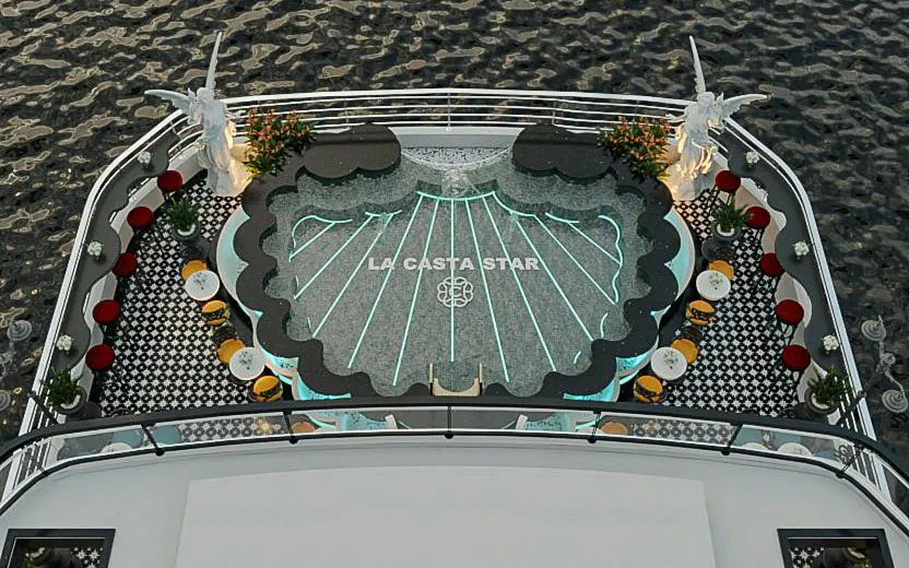 La Casta Star cruise deck with elegant seating and decorative lighting in Lan Ha Bay.