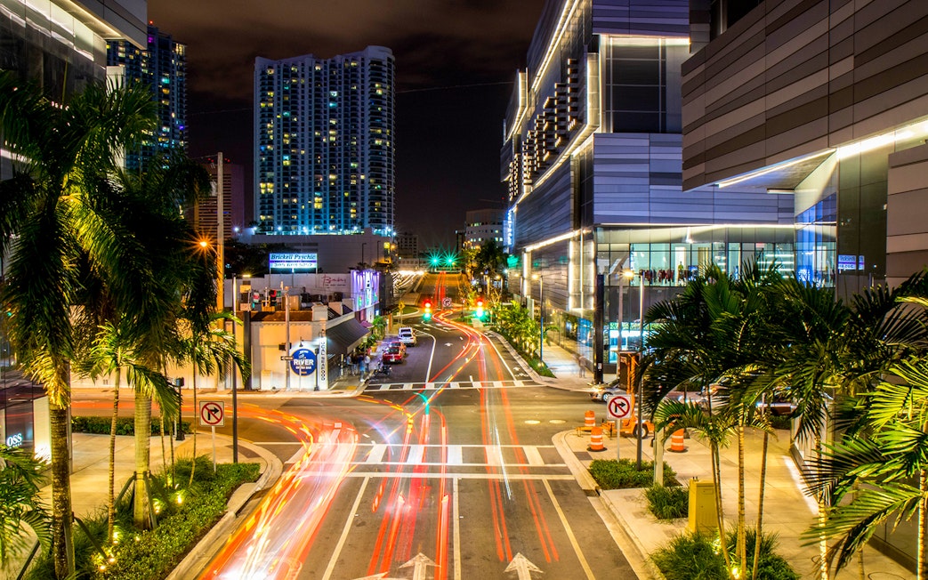 Miami cityscape at night with light trails from traffic, viewed during Big Bus: Miami Panoramic Night Bus Tour.
