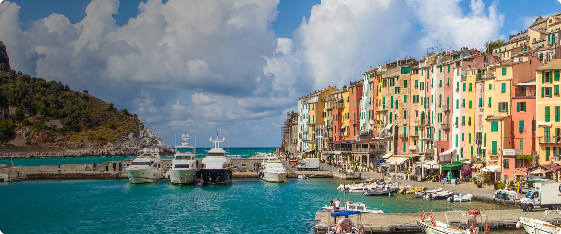 Colorful buildings and boats in the harbor of La Spezia, Italy.