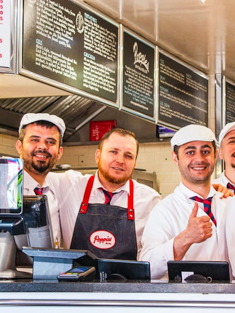 Staff at Poppies Fish and Chips in London during the Brick Lane food tour.