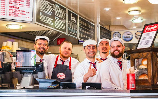 Staff at Poppies Fish and Chips in London during the Brick Lane food tour.