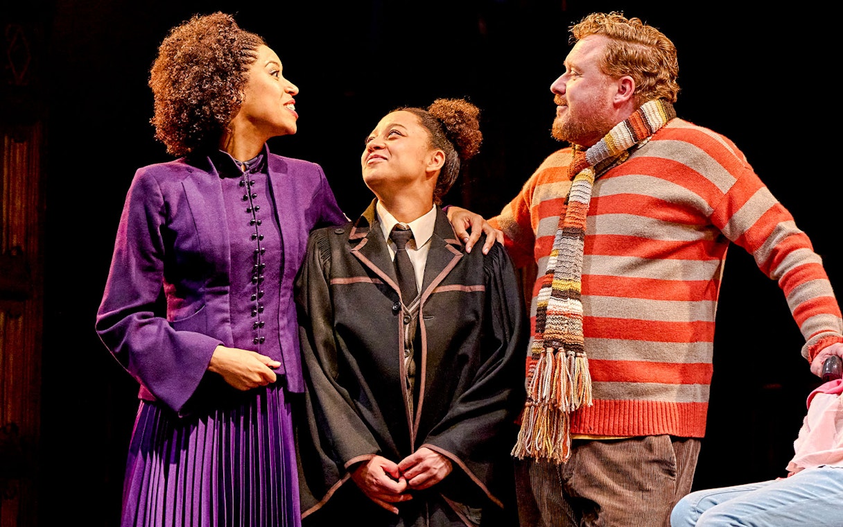 Actors in costume on stage during "Harry Potter and the Cursed Child" performance.