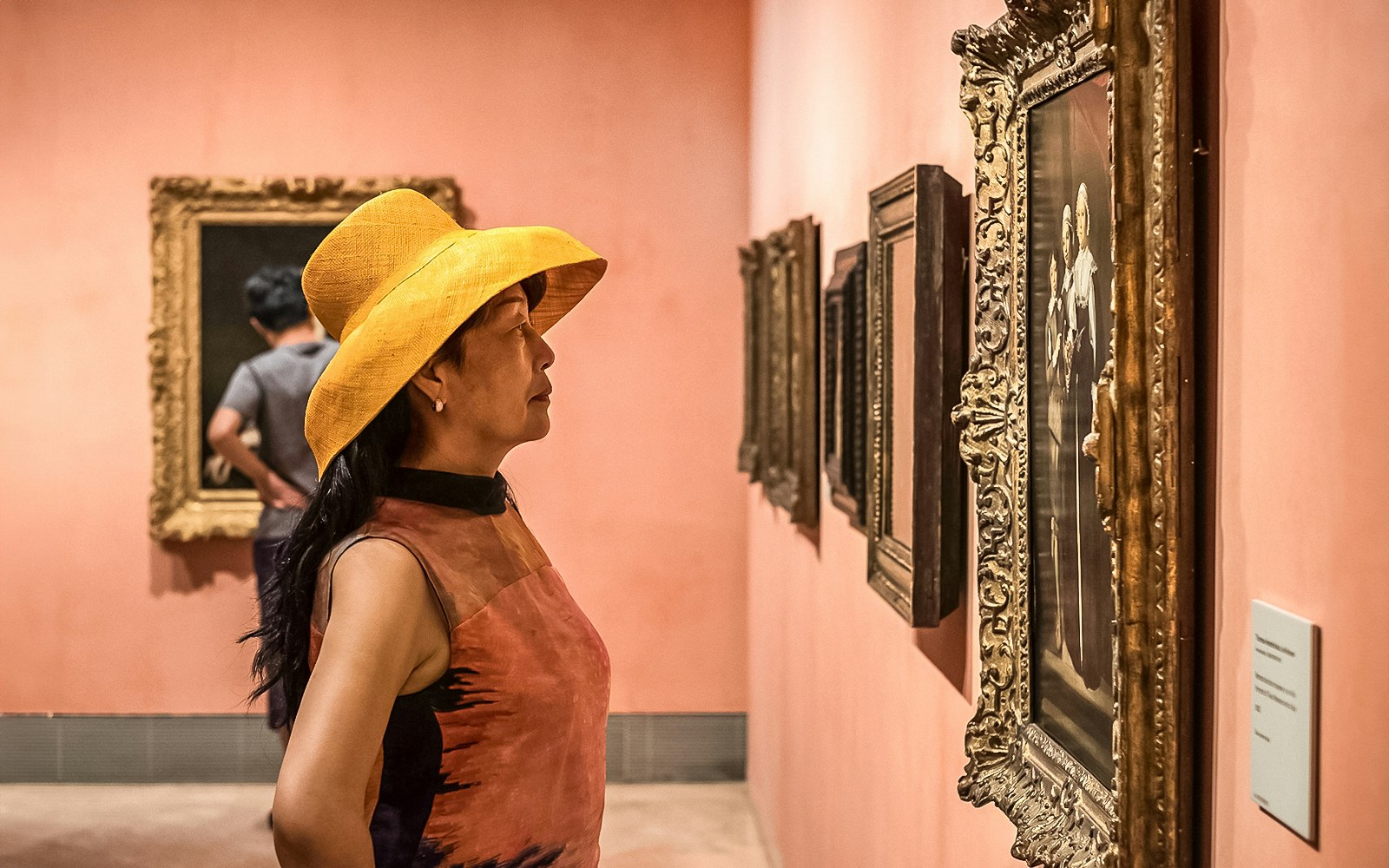 Visitors viewing paintings at Thyssen Bornemisza Museum, Madrid.