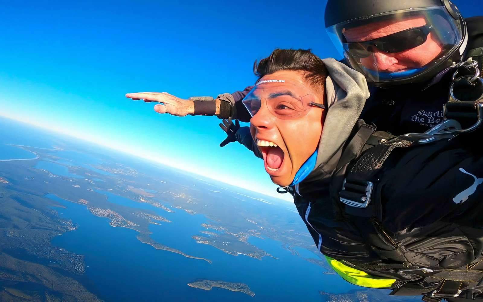 Tandem skydiving over Newcastle Beach, Sydney with ocean view.