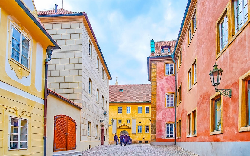 Colourful houses on Golden Lane in Prague with cobblestone street.