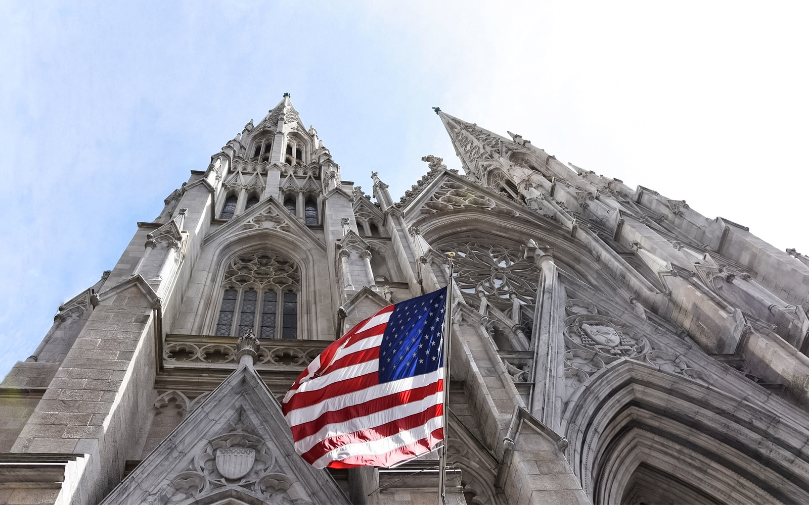 St. Patrick's Cathedral facade with American flag, New York City.