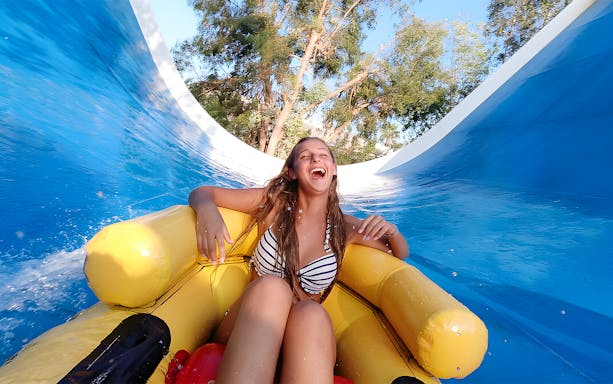 Person enjoying a water slide at Aquasplash Antibes.