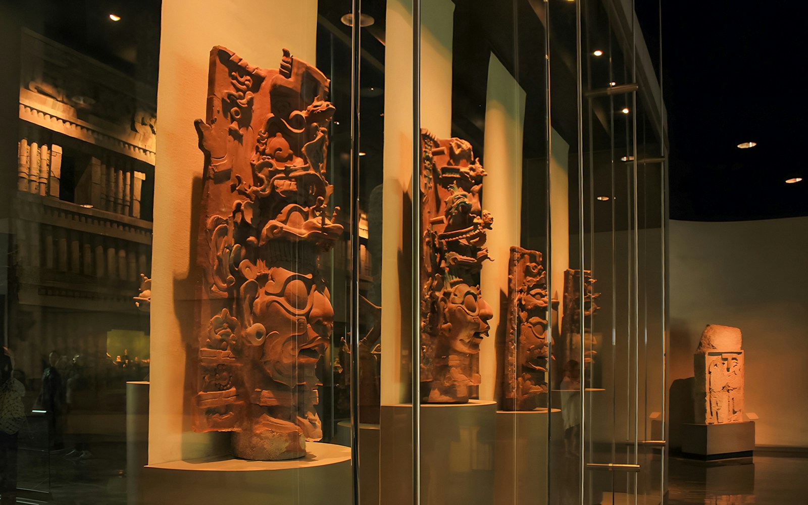 Visitors exploring exhibits at the Anthropology Museum in Mexico City.