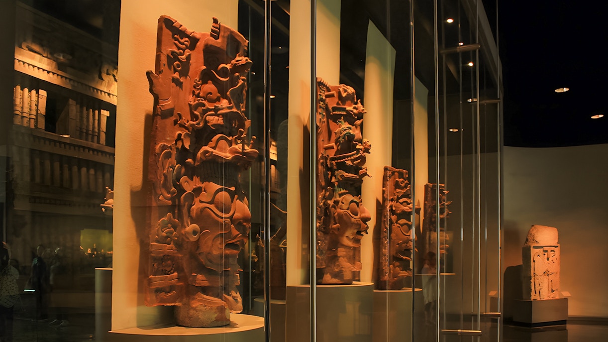 Visitors exploring exhibits at the Anthropology Museum in Mexico City.