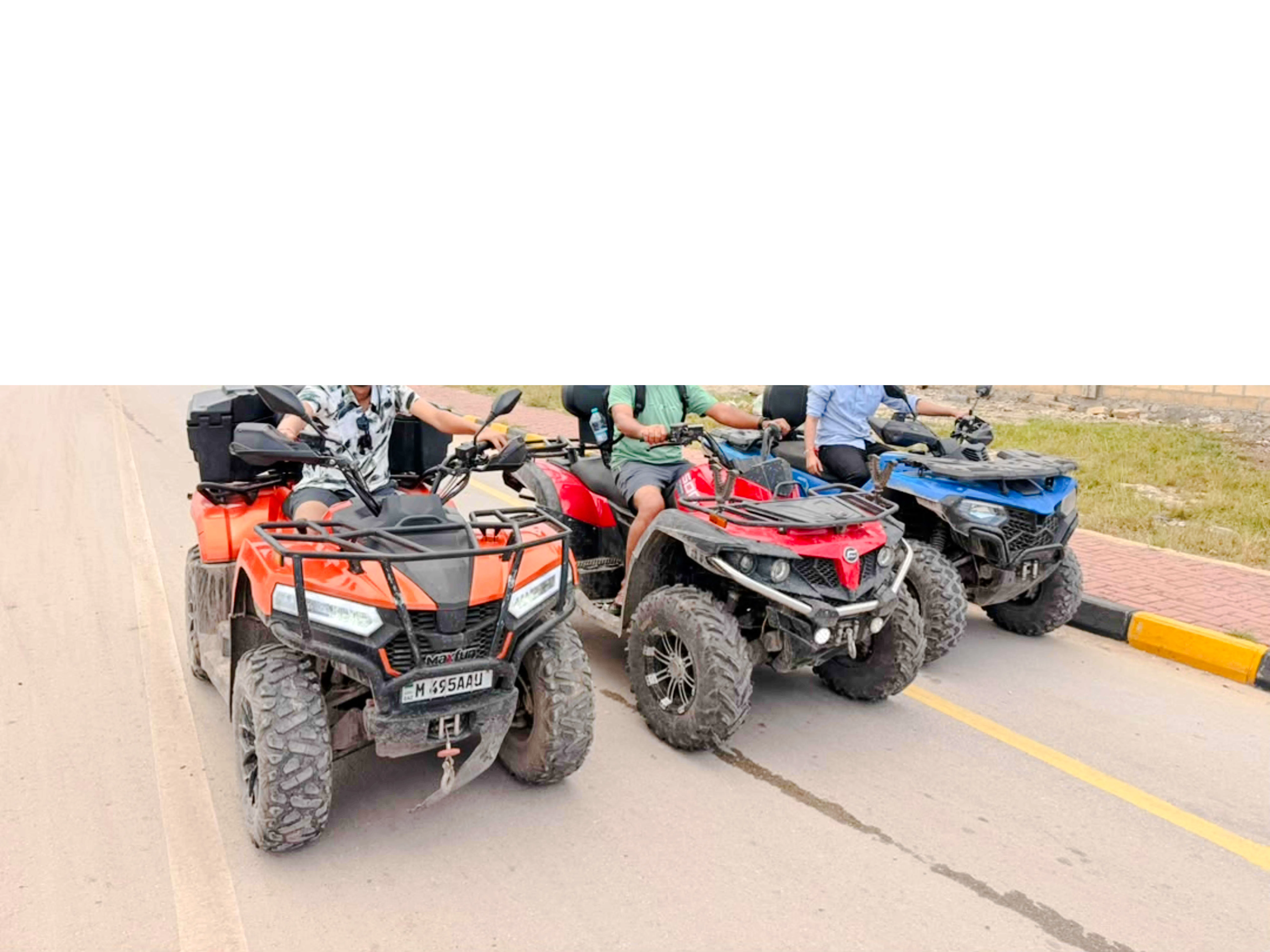 Quad bikes lined up for an adventure tour in Zanzibar.
