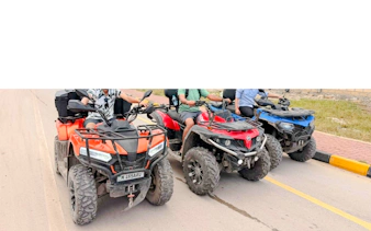Quad bikes lined up for an adventure tour in Zanzibar.