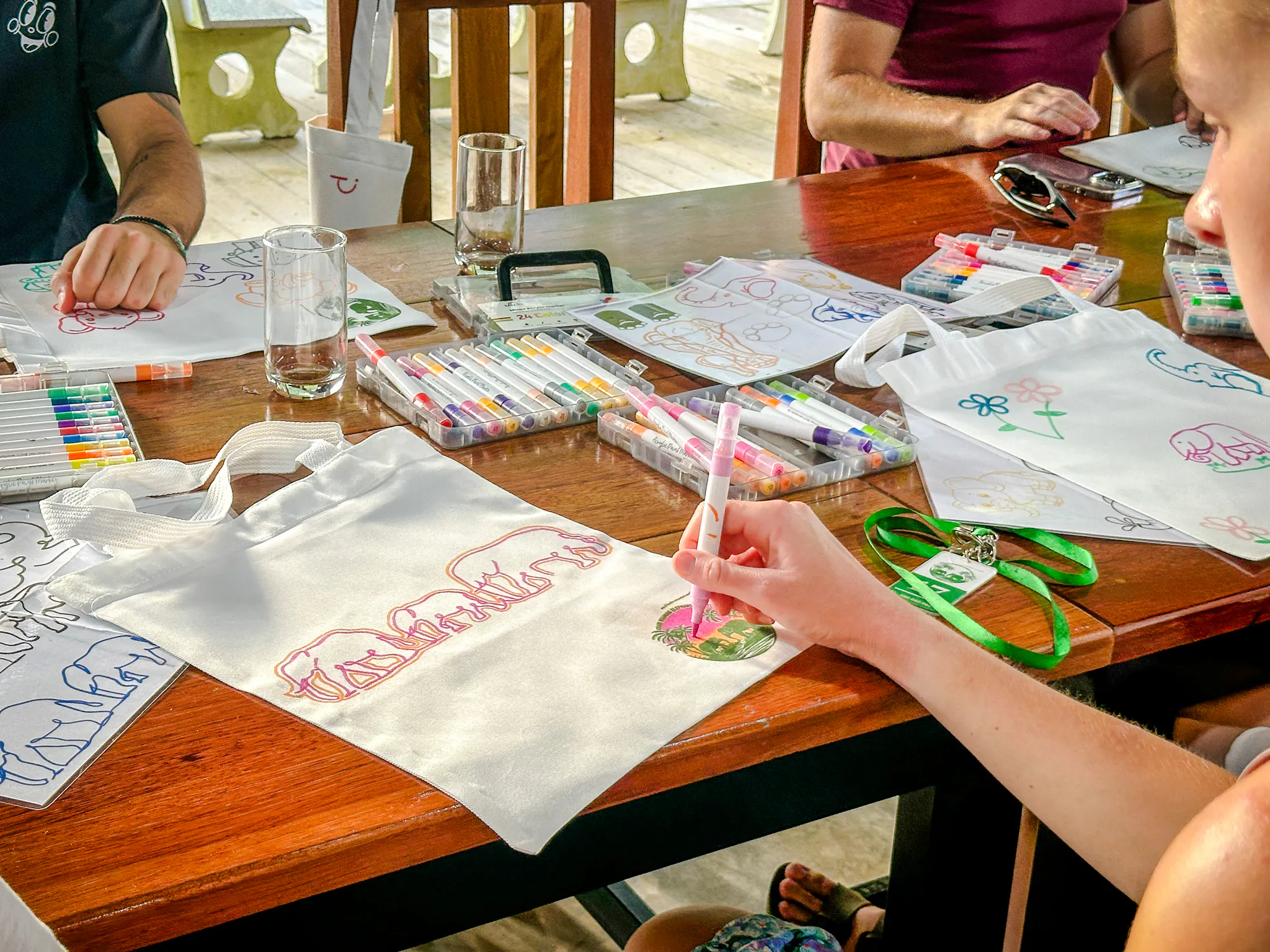 Guests decorating tote bags at Krabi Roaming Elephant Sanctuary, Krabi.