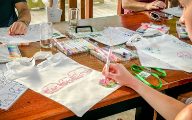 Guests decorating tote bags at Krabi Roaming Elephant Sanctuary, Krabi.