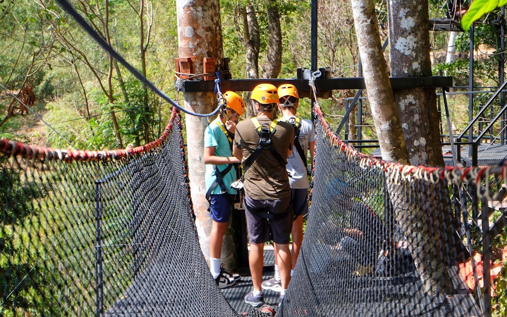Participants preparing for a zipline adventure in Phuket, Thailand.