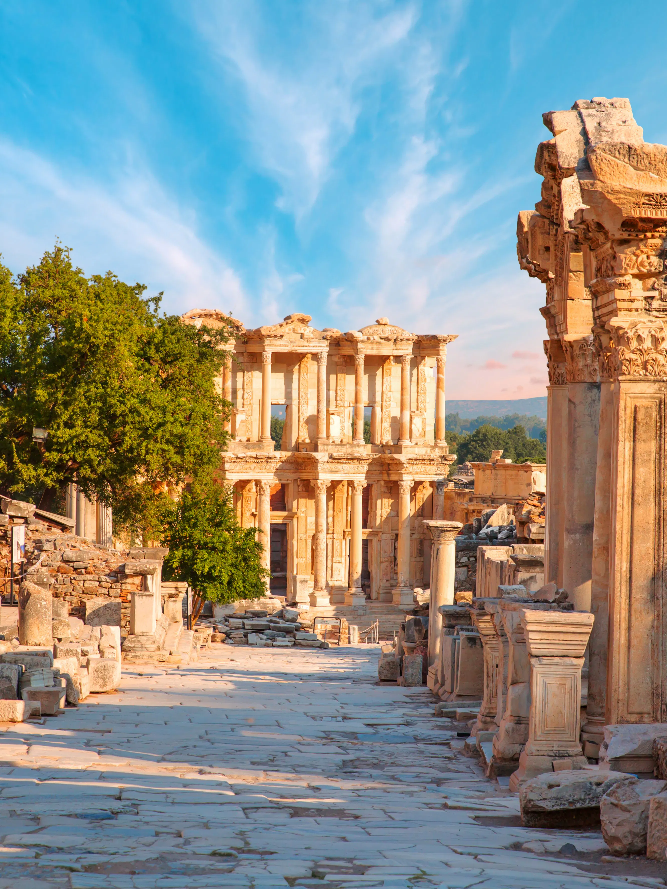 Celsus Library ruins in Ephesus, Turkey, with ancient stone columns and clear sky.