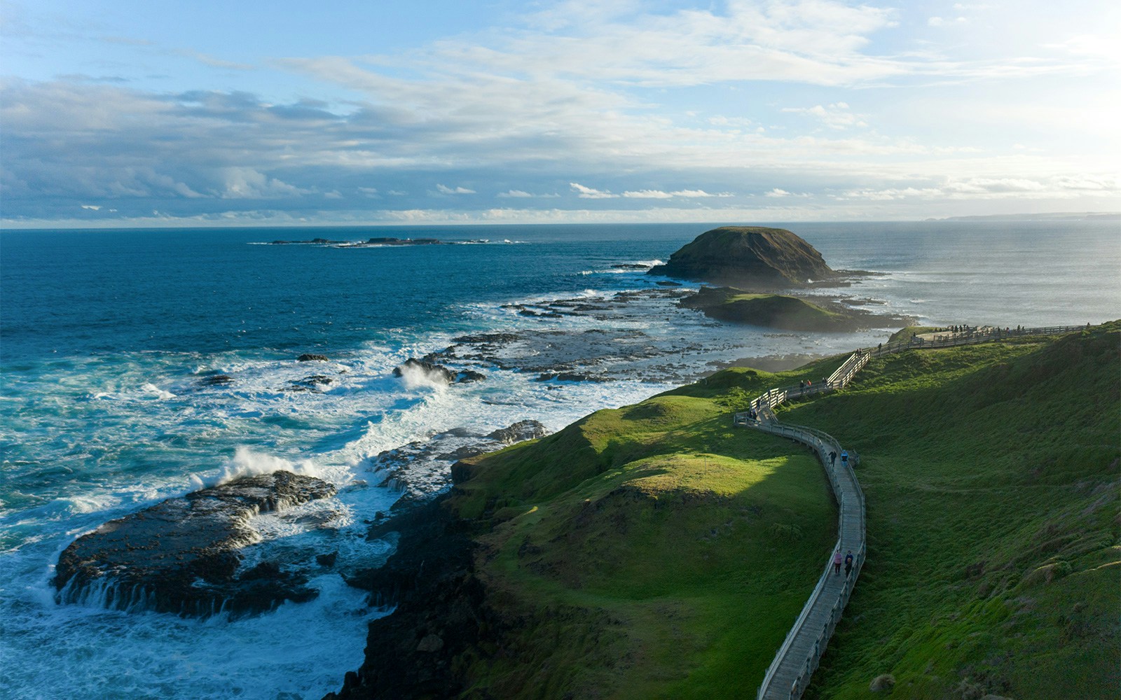 Phillip Island Nobbies coastal view with boardwalk and ocean waves.