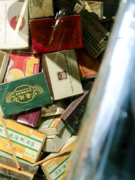 Collection of vintage matchboxes from Hong Kong restaurants, related to Peak Tram & Sky Terrace tour.