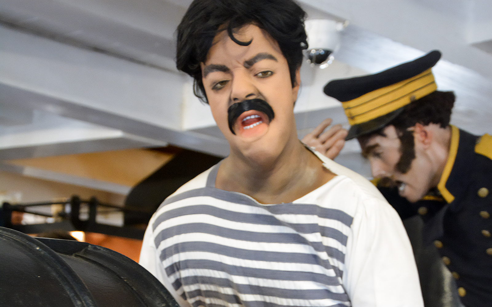 Crew members in historical attire aboard Frigate D. Fernando II e Glória.