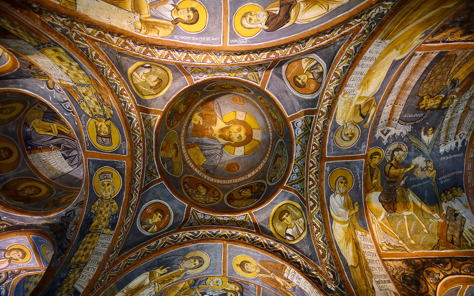 Frescoes on the ceiling of a church in Göreme Open-Air Museum, Cappadocia, depicting religious figures.