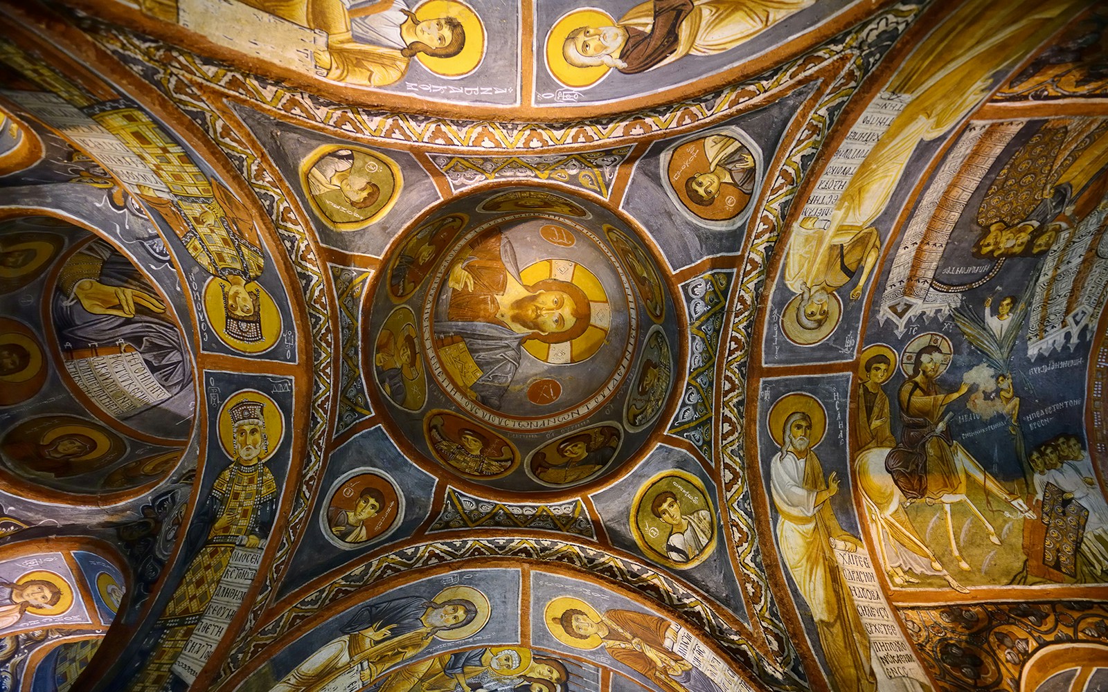 Frescoes on the ceiling of a church in Göreme Open-Air Museum, Cappadocia, depicting religious figures.