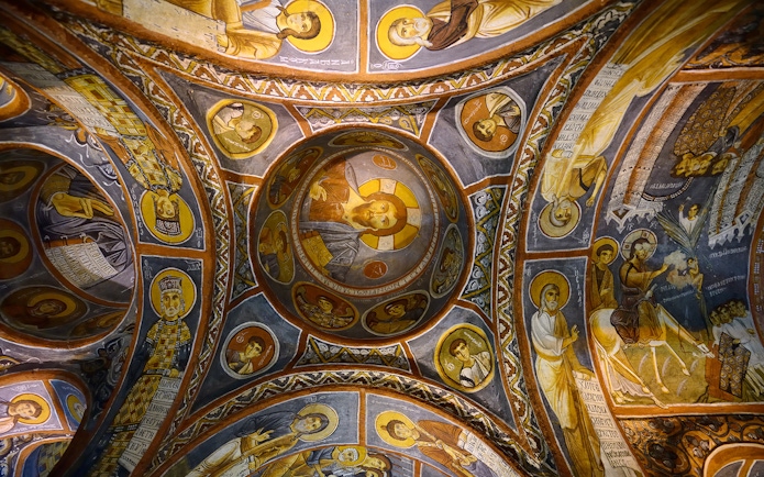 Frescoes on the ceiling of a church in Göreme Open-Air Museum, Cappadocia, depicting religious figures.
