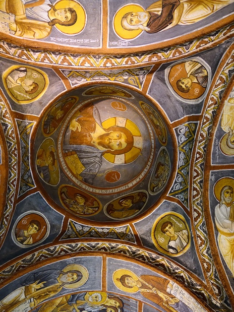 Frescoes on the ceiling of a church in Göreme Open-Air Museum, Cappadocia, depicting religious figures.